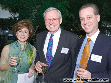 RICHARD HALL (center) with SHERI and SCOTT GILMAN at the International School auction.