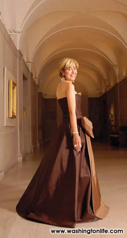 MEVHIBE (“MIMI”) LOGOGLU wife of Turkish Ambassador O. Faruk Logoglu in a taupe and café strapless satin gown by YILDIRIM MAYRUK with bronze cluster necklace