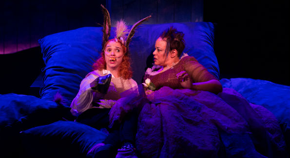 Bottom (Holly Twyford, left) finds herself in a fantastical situation, lying beside Titania, Queen of the Fairies (Caroline Stefanie Clay), in "A Midsummer Night’s Dream" (Photo by Teresa Wood)