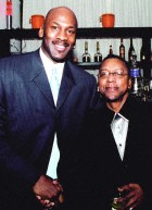 Michael Jordan greets Black Entertainment Television (BET) CEO and Chairman Robert Johnson at jordans.