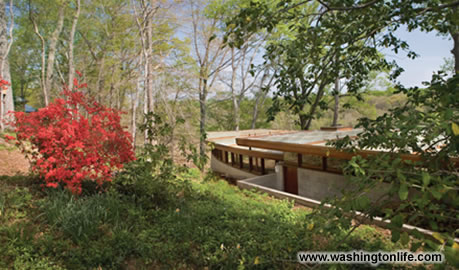 The restrained exterior features a flat copper roof