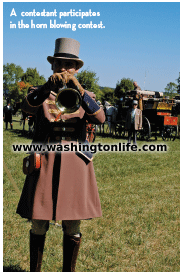 A contestant participates in the horn blowing contest.