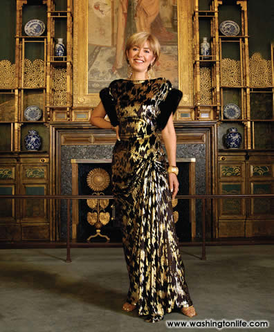 MEVHIBE (&ldquo;MIMI&rdquo;) LOGOGLU wife of Turkish Ambassador O. Faruk Logoglu in a black and gold cut velvet dress with fur trim by YILDIRIM MAYRUK
