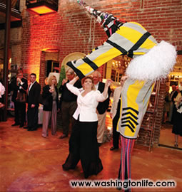 Deborah Gore Dean and stilt walker